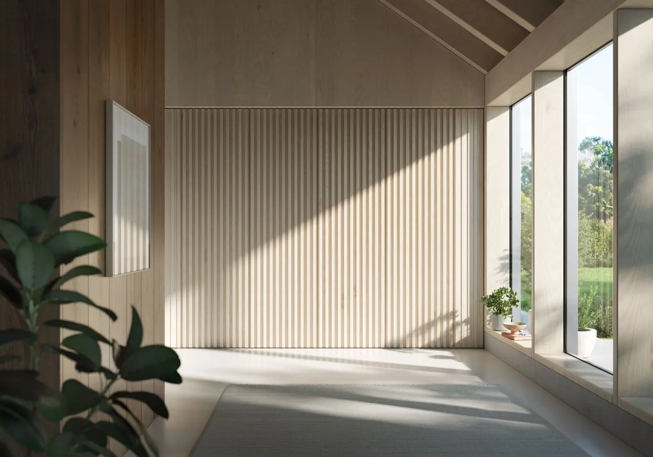 Heller holzvertäfelter Wohnflur mit Lamellenwand und bodentiefer Fensterfront zum Garten; die Wohnraumlüftung ist unsichtbar in die Wand integriert.